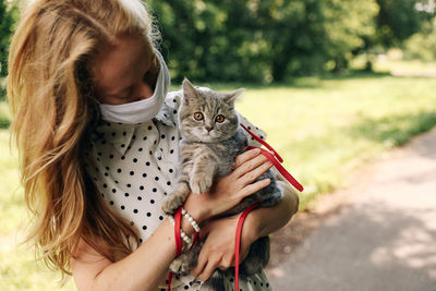 Close-up of woman holding cat