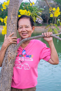 Woman holding a tree