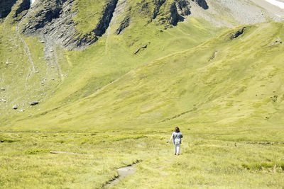 Rear view of woman walking on land