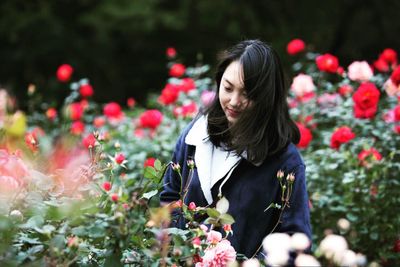 Young woman standing in park