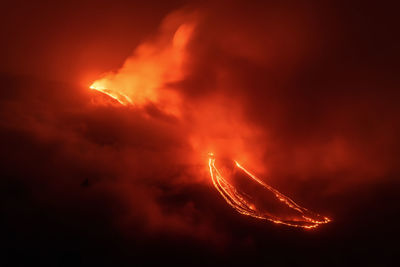 Low angle view of fire against sky at night