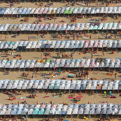Aerial view of tourists resting under parasols