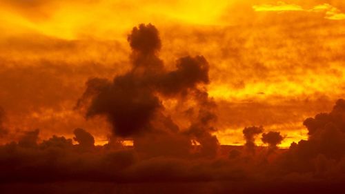 Scenic view of cloudy sky at sunset