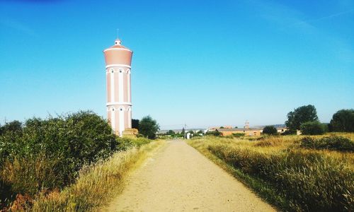 View of lighthouse against clear blue sky