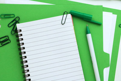 Close-up of green paper on hardwood floor