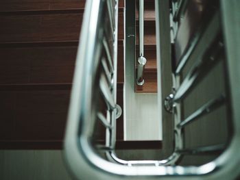 Close-up of metal railing against wall