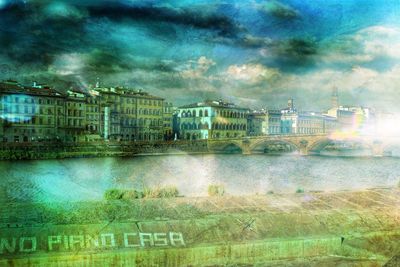 Buildings against cloudy sky