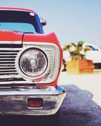 Close-up of vintage car against blue sky