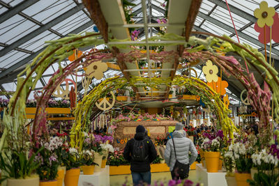 Rear view of people walking in amusement park