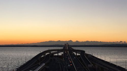 Scenic view of sea against clear sky during sunset