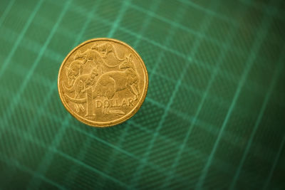 High angle view of coins on metal