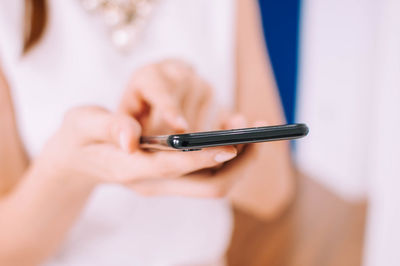 Close-up of woman using mobile phone