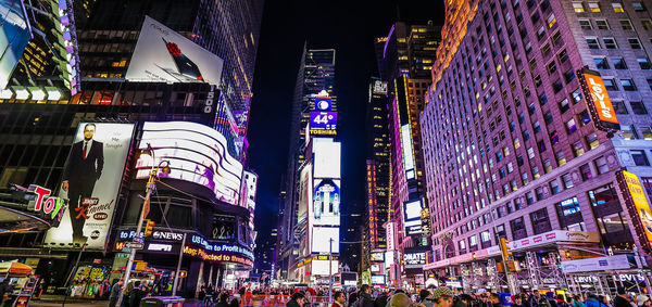 People on city street at night