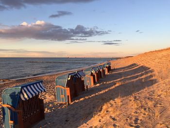 Scenic view of beach against sky during sunset