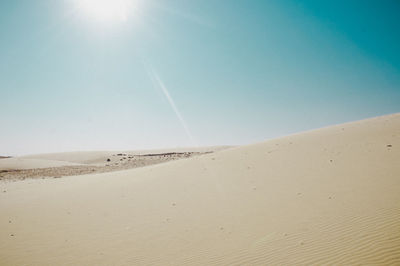 Scenic view of desert against clear sky