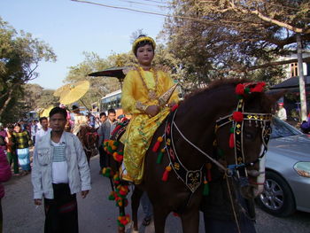 People on horse against sky