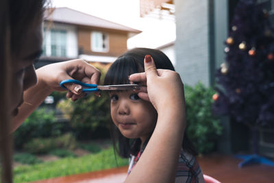 Portrait of woman holding camera