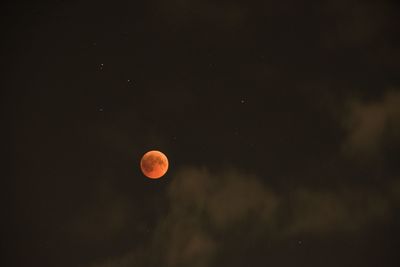 Low angle view of moon against sky at night