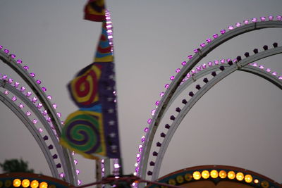 Low angle view of illuminated ferris wheel