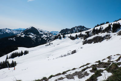 Scenic view of snow mountains against clear sky