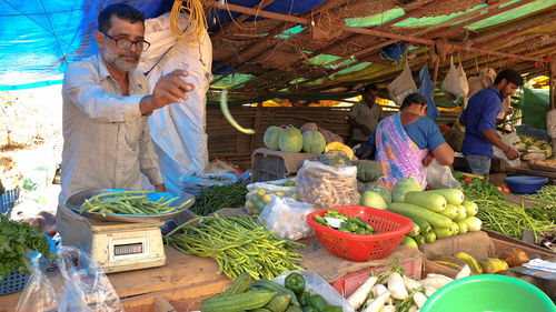 Group of people at market stall