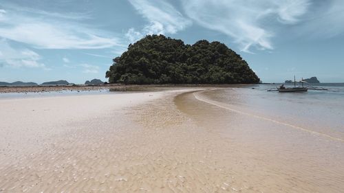 Scenic view of beach against sky