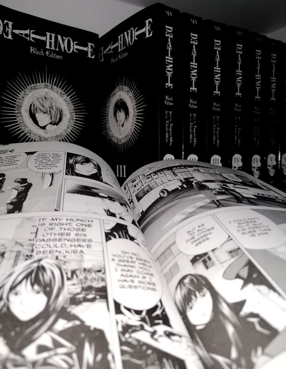 black and white, monochrome photography, monochrome, manga, no people, font, poster, book, black, close-up, finance, indoors