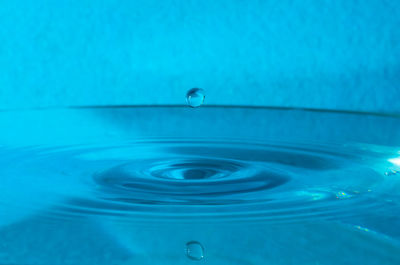 Close-up of water falling in swimming pool