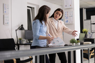 Female doctor examining patient in office