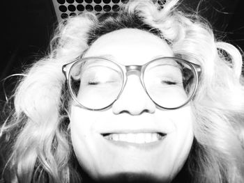 Close-up portrait of smiling young woman