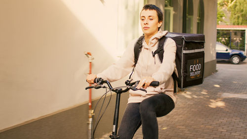 Portrait of young woman using mobile phone