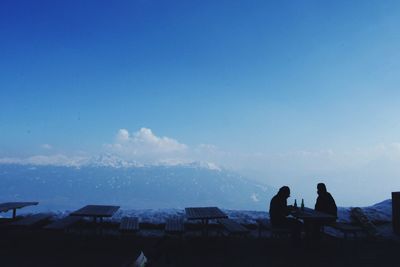 Scenic view of landscape against blue sky
