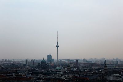 View of communications tower in city