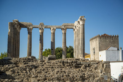 Low angle view of old ruins against clear sky