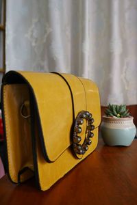 Close-up of yellow ring on table at home