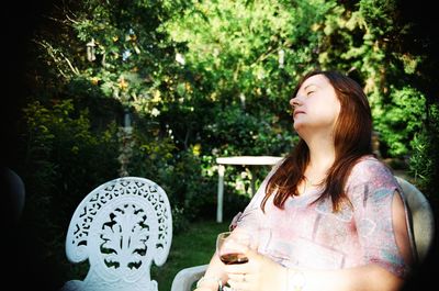 Woman relaxing in garden