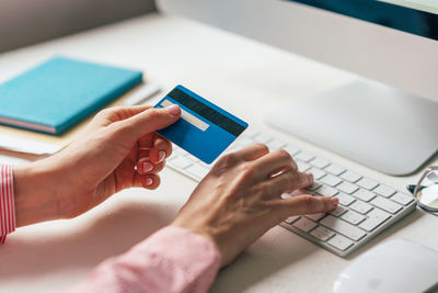 Cropped image of woman doing online payment