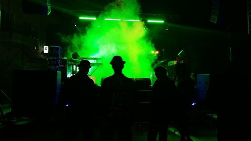 Group of people standing in nightclub