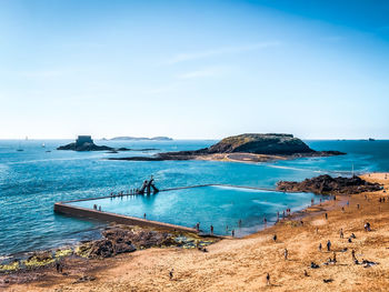 Scenic view of bay against clear sky