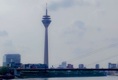 View of buildings against cloudy sky