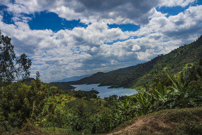 Scenic view of lake and mountains against sky