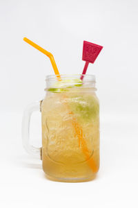 Close-up of drink against white background