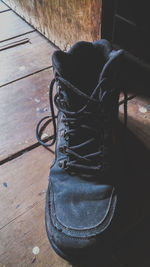 High angle view of black shoes on hardwood floor