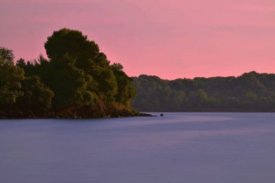 Scenic view of landscape against sky at sunset