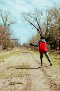 Child running free in rural path