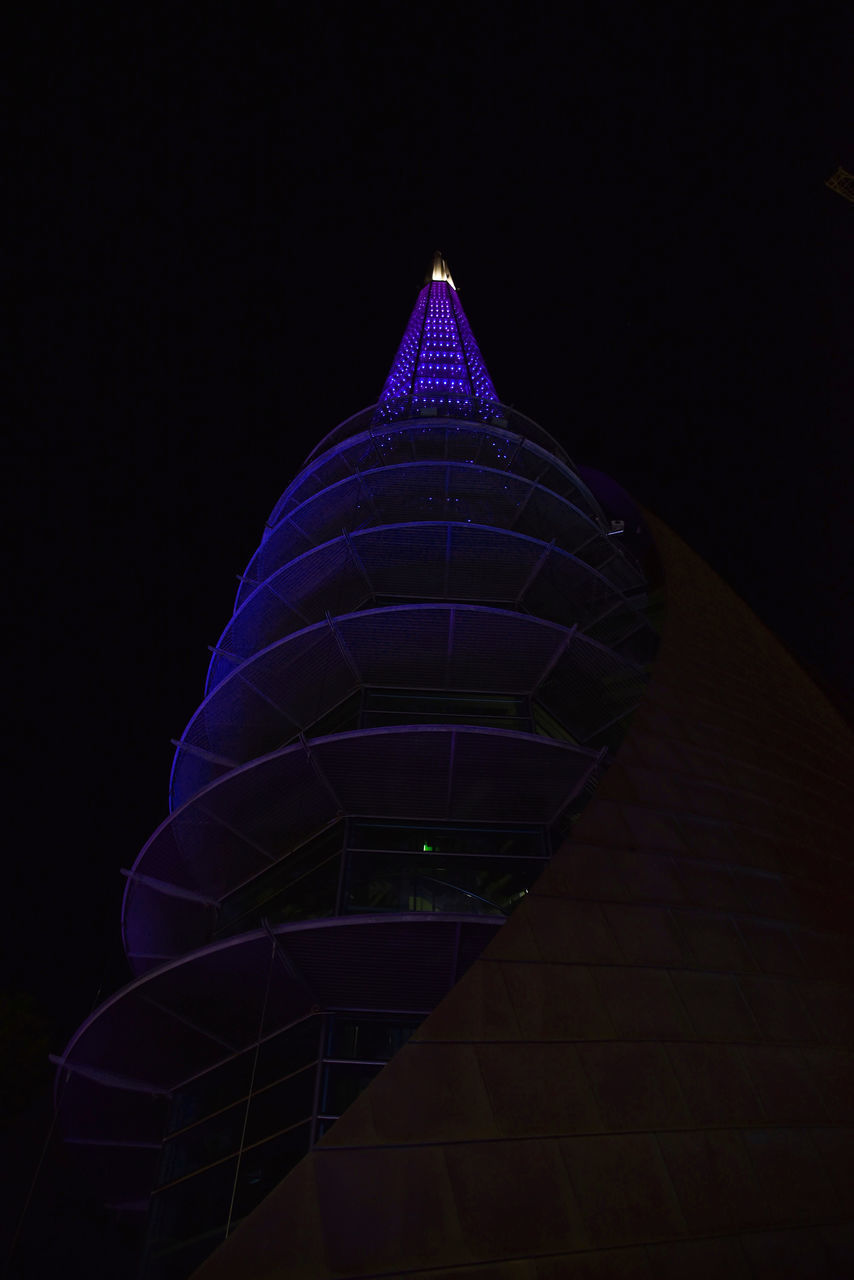 LOW ANGLE VIEW OF ILLUMINATED BUILDING AGAINST SKY