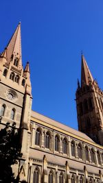 Low angle view of building against blue sky