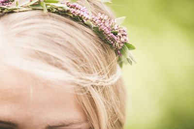 Close-up of woman wearing flowers in hair