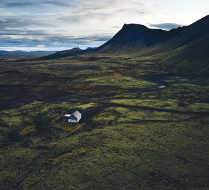 Mountain valley with lonely house