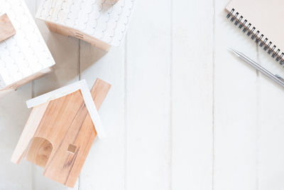 High angle view of art on table against white wall